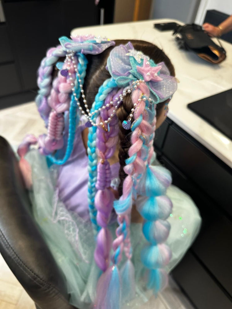 Children with glitter braids at a Glitter Braid Bar party