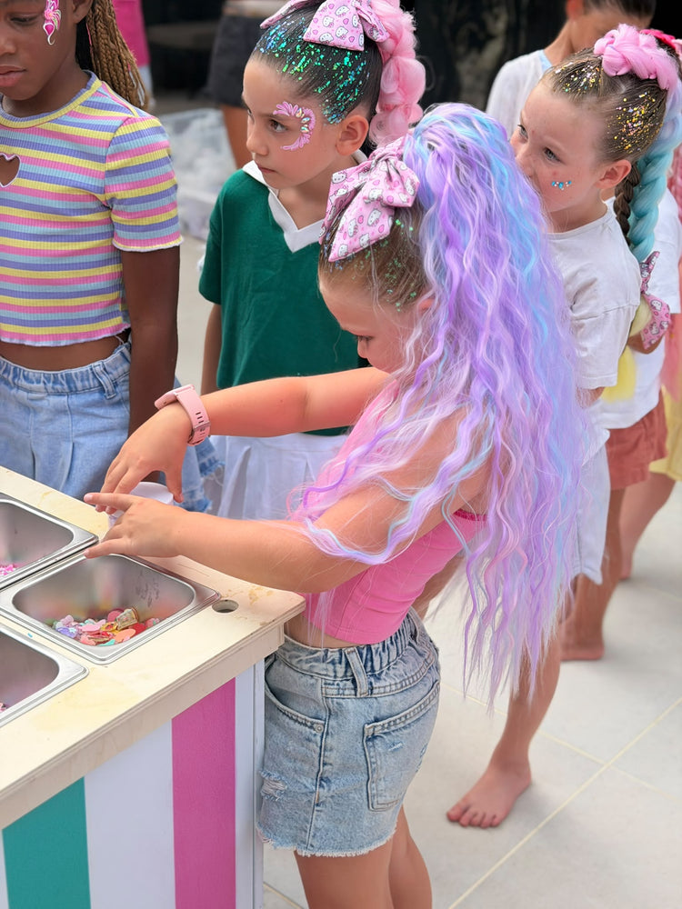 Children with glitter braids at a Glitter Braid Bar party