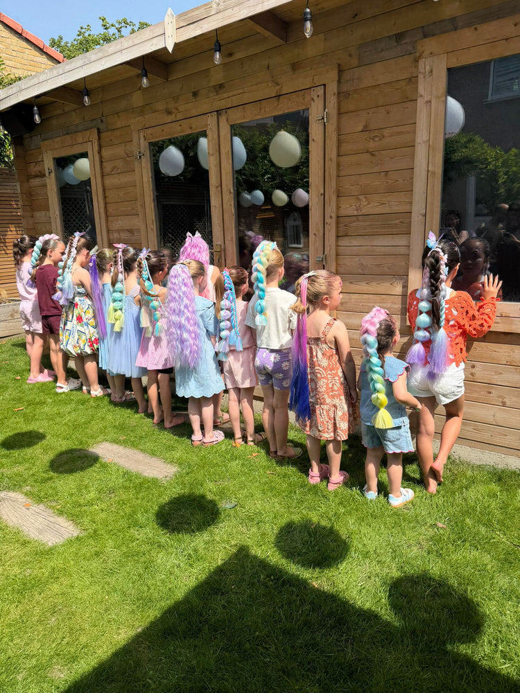 Children with glitter braids at a Glitter Braid Bar party