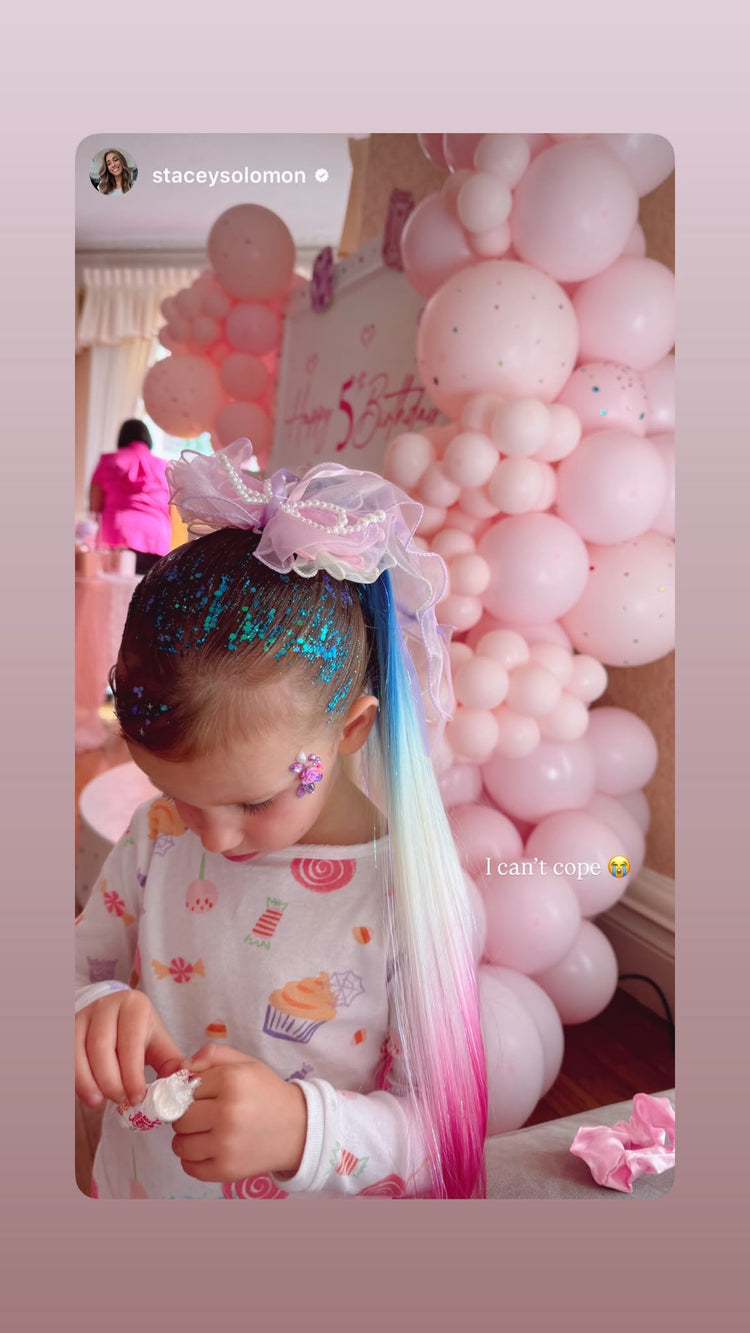 Glitter roots and a rainbow hair extension with a pearl bow, shared on Stacey Solomon's Instagram