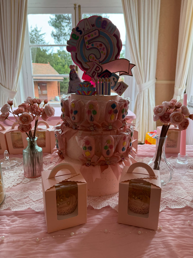 Rose's 5th birthday cake and pink party table with treat boxes
